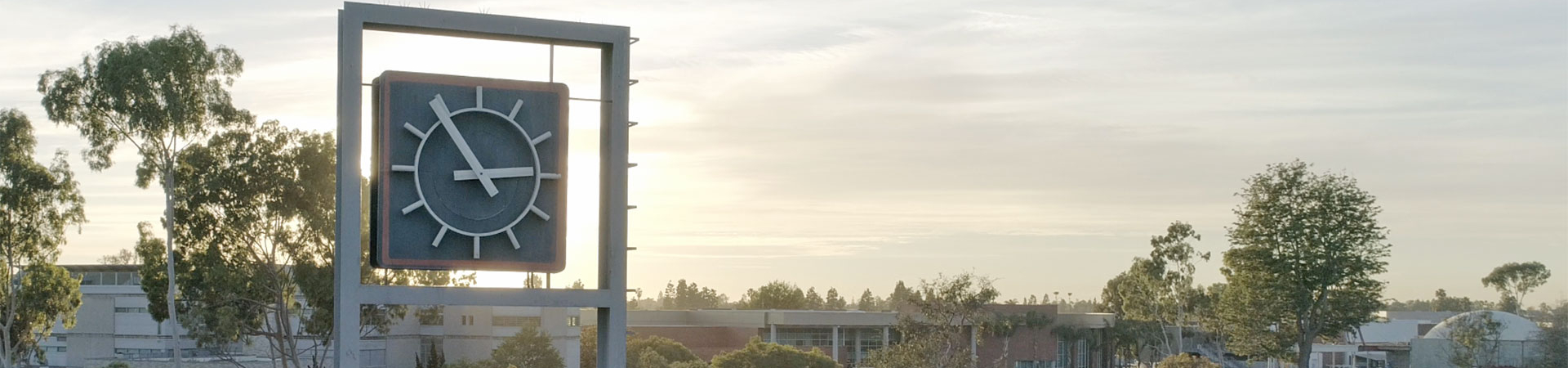 OCC Clock Tower with campus and sunset in background